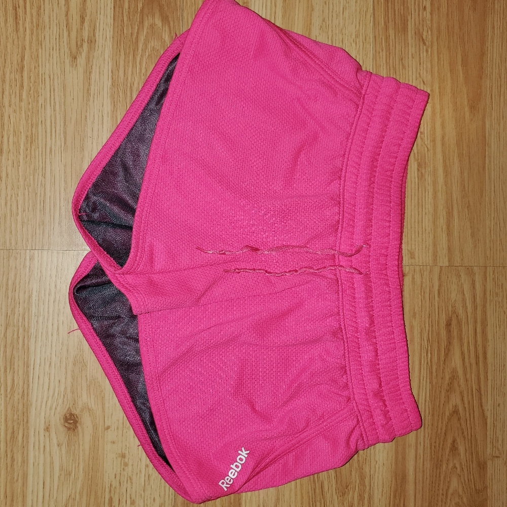 Pink reebok athletic shorts
